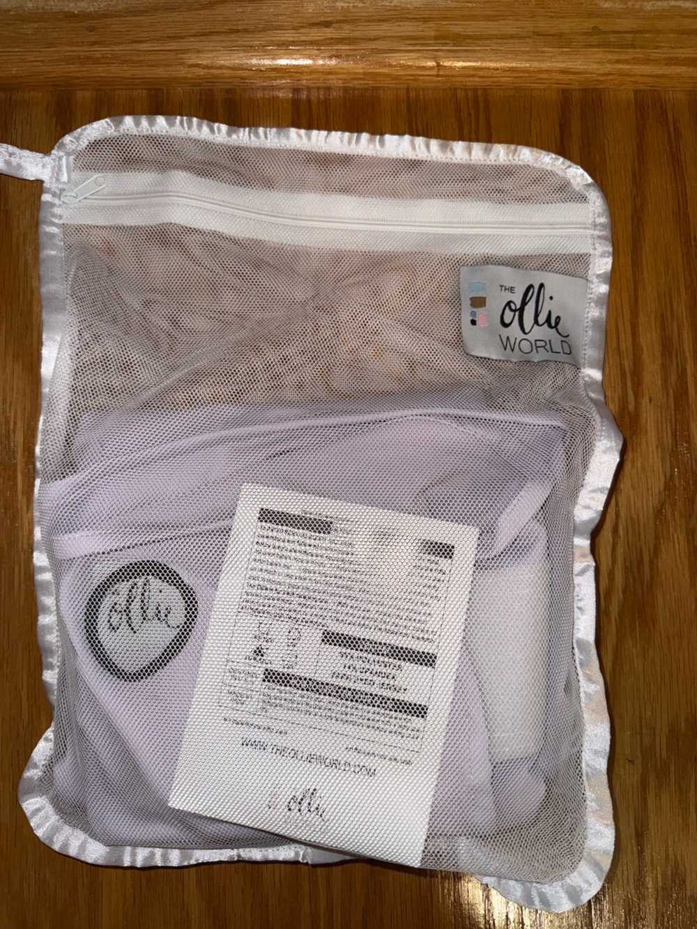 The Ollie World purple swaddle with Mesh Storage Bag